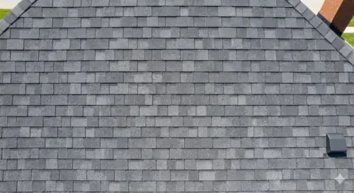 Close-up of grey architectural asphalt shingles on a residential roof
